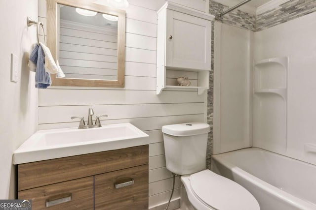 full bathroom with vanity, shower / washtub combination, wooden walls, toilet, and ornamental molding