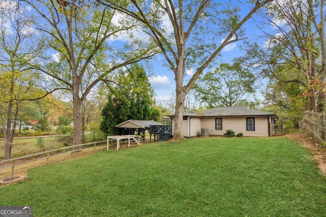 view of yard featuring central AC unit