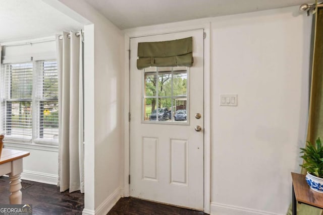 doorway to outside featuring dark hardwood / wood-style flooring