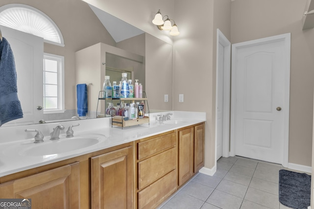 bathroom featuring tile patterned flooring and vanity