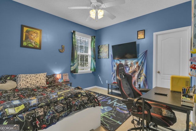 bedroom featuring ceiling fan and a textured ceiling