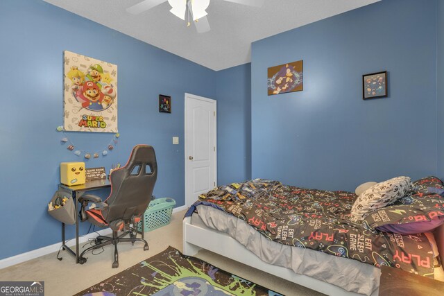 bedroom featuring ceiling fan and carpet floors