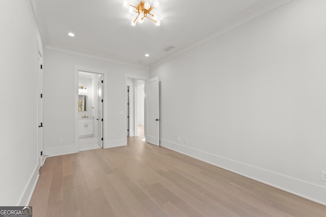 unfurnished bedroom featuring connected bathroom, crown molding, and light hardwood / wood-style flooring