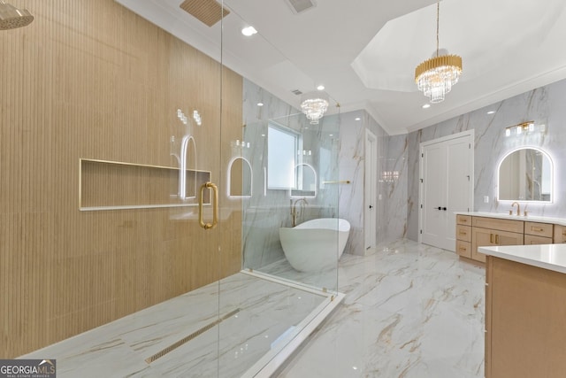 bathroom with vanity, an inviting chandelier, and independent shower and bath