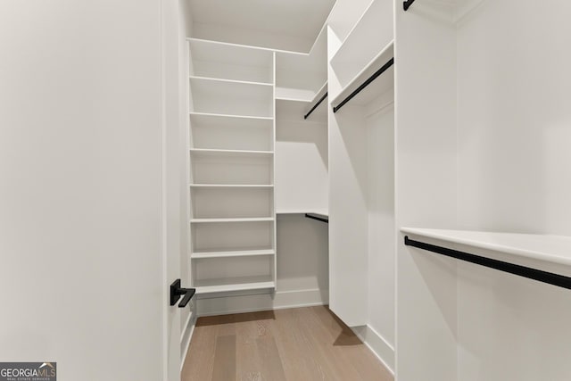 walk in closet featuring light wood-type flooring