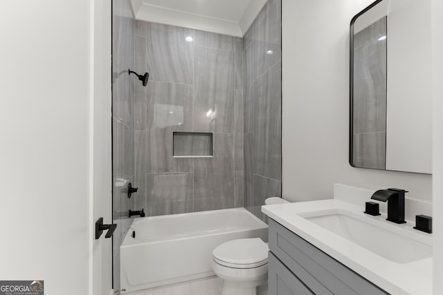 full bathroom featuring vanity, toilet, and tiled shower / bath