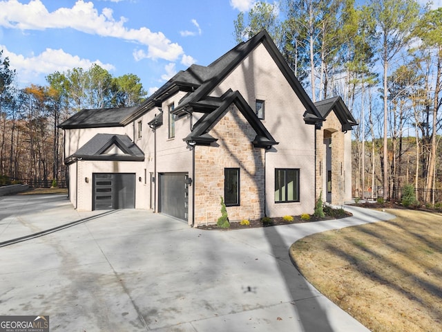 view of side of home featuring a garage