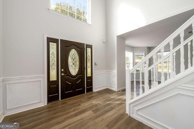 foyer entrance with dark hardwood / wood-style floors