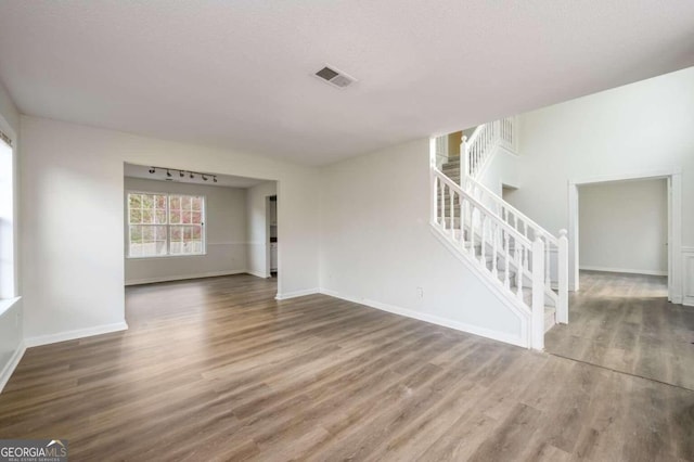 empty room with dark wood-type flooring