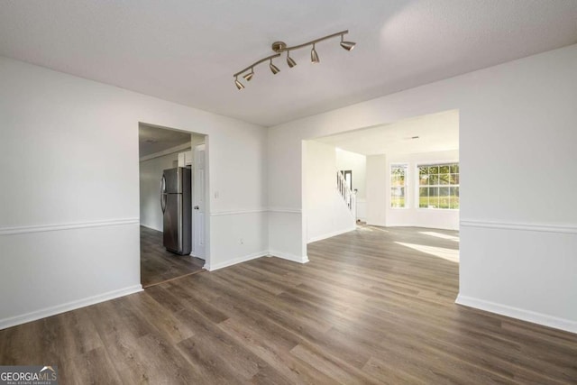 empty room featuring dark wood-type flooring