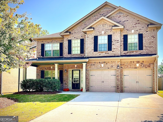 craftsman-style house featuring a front yard and a garage