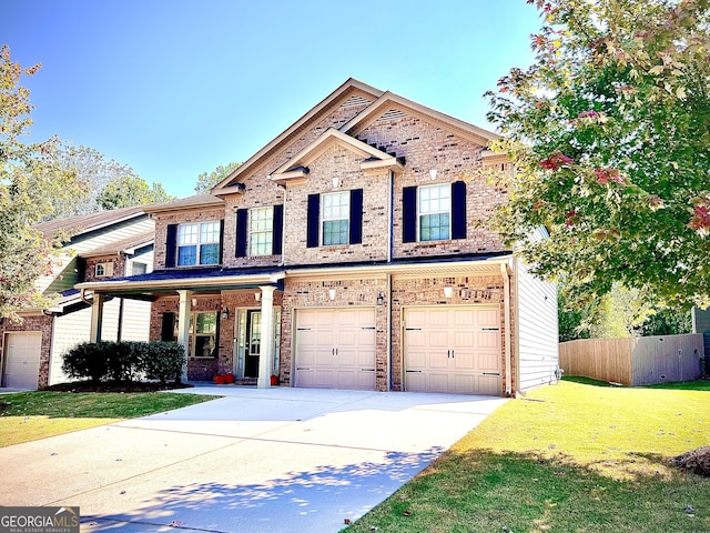 view of front facade featuring a front yard and a garage