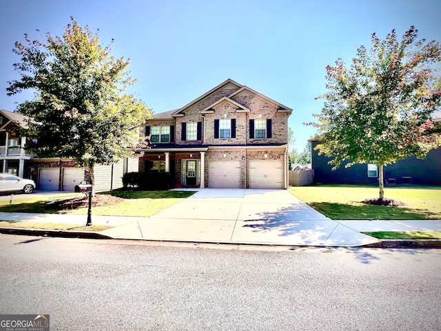 view of front of property with a front lawn and a garage