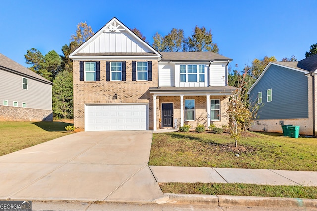 view of front of house featuring a garage and a front lawn