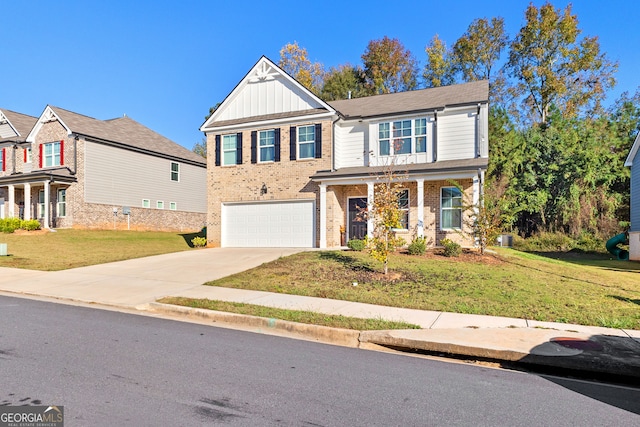 view of front of home with a front yard and a garage