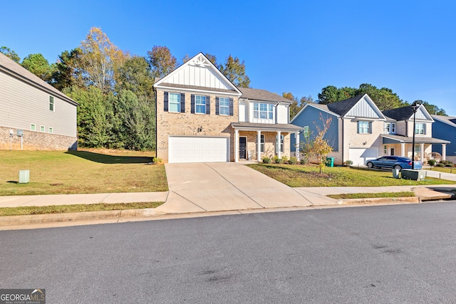 view of front of house featuring a front yard, a porch, and a garage