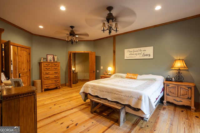 bedroom featuring ceiling fan, light hardwood / wood-style flooring, and crown molding