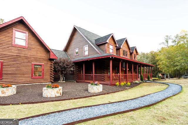 back of property featuring a porch