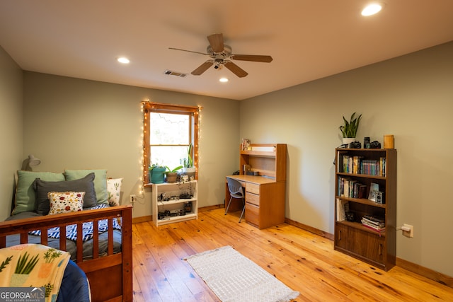 bedroom with ceiling fan and light wood-type flooring