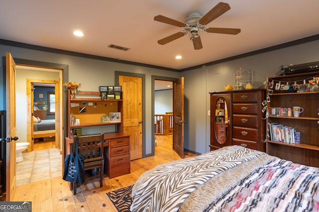 bedroom featuring light hardwood / wood-style floors, ceiling fan, and ornamental molding