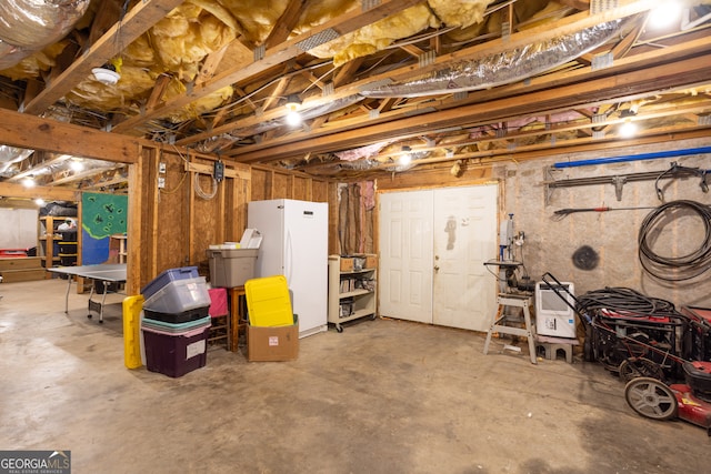 basement with white fridge