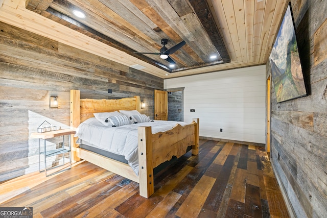 bedroom with wood walls and dark hardwood / wood-style floors