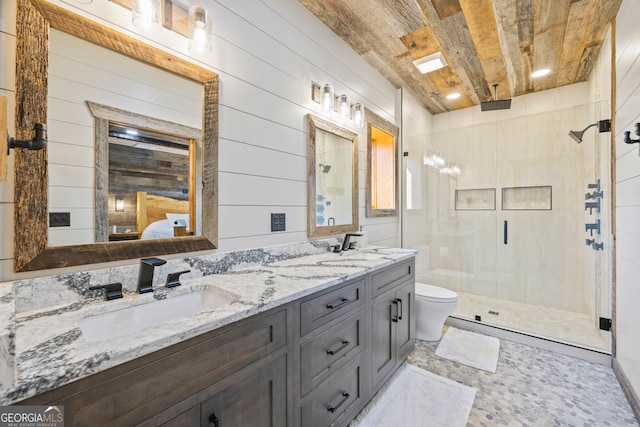 bathroom featuring vanity, a shower with door, wooden ceiling, wooden walls, and toilet