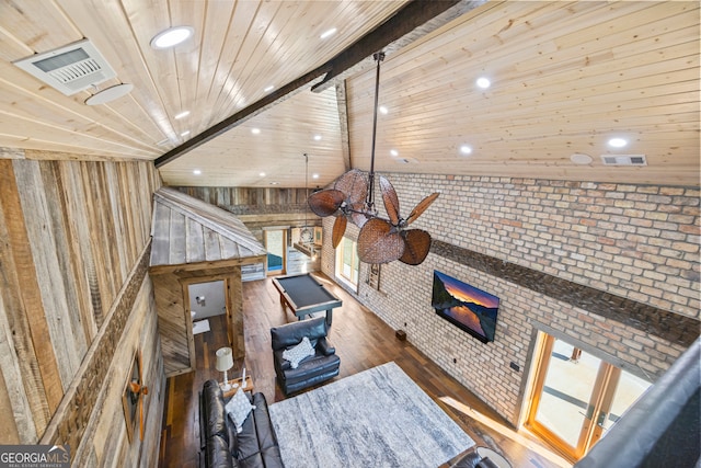 living room with wooden ceiling, lofted ceiling with beams, ceiling fan, dark hardwood / wood-style floors, and brick wall