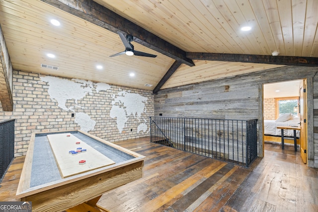 rec room featuring dark hardwood / wood-style flooring, vaulted ceiling with beams, ceiling fan, and wooden ceiling