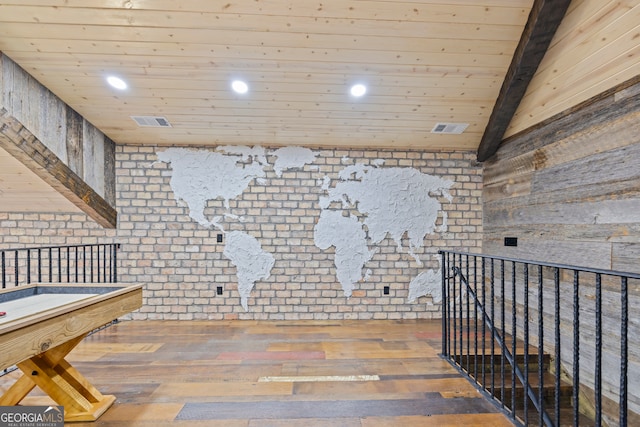 rec room with vaulted ceiling with beams, wood-type flooring, and wooden ceiling