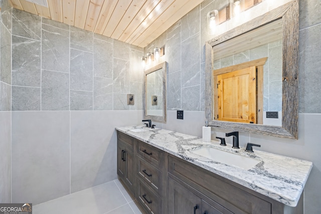 bathroom featuring tile patterned flooring, vanity, tile walls, and wood ceiling