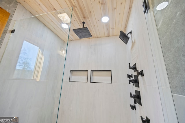 bathroom with a shower and wooden ceiling