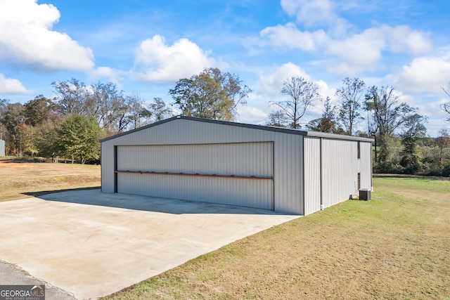 garage featuring a yard