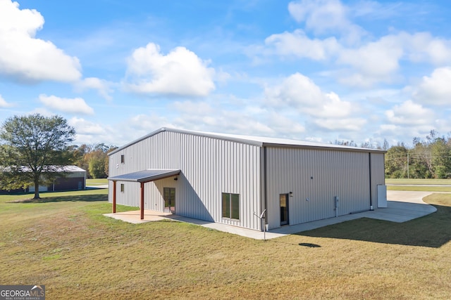 exterior space with a yard and an outdoor structure