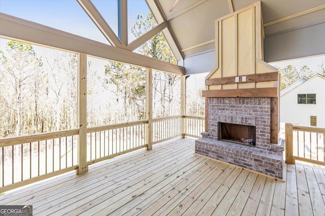 deck with a brick fireplace