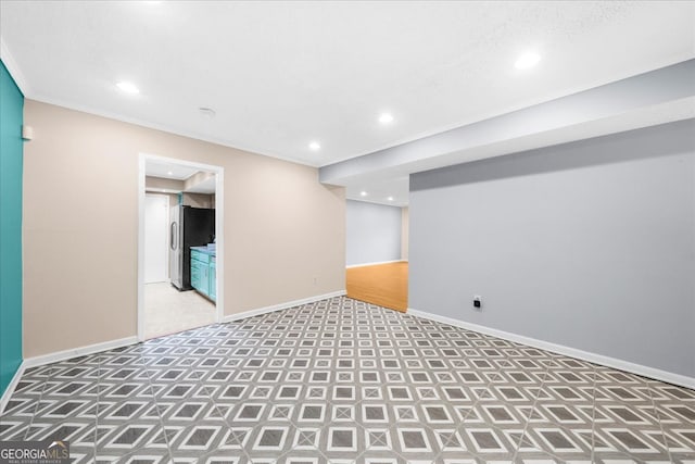 interior space featuring crown molding and carpet