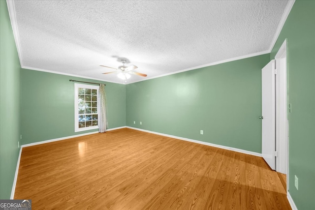 unfurnished room featuring ceiling fan, light hardwood / wood-style floors, crown molding, and a textured ceiling