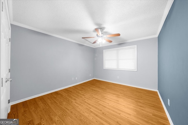 unfurnished room with crown molding, light hardwood / wood-style flooring, and a textured ceiling