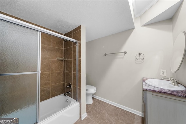 full bathroom with shower / bath combination with glass door, tile patterned flooring, vanity, and toilet