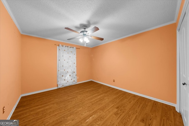 unfurnished room featuring ceiling fan, crown molding, a textured ceiling, and hardwood / wood-style flooring