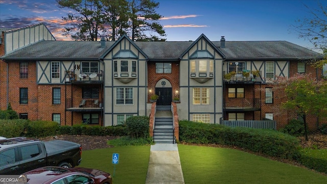 tudor home with a yard