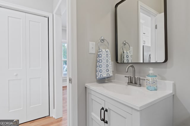 bathroom featuring hardwood / wood-style floors and vanity