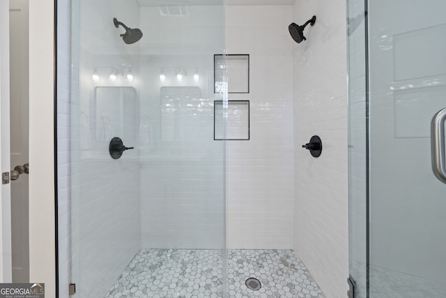 bathroom featuring an enclosed shower