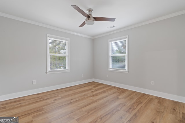 unfurnished room featuring ceiling fan, light hardwood / wood-style flooring, and ornamental molding