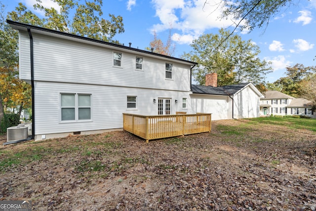 back of house featuring central AC unit and a wooden deck