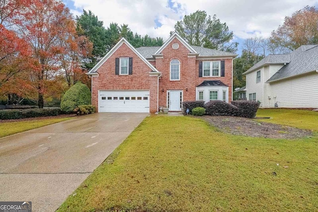 view of property with a front lawn and a garage