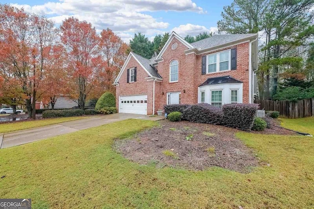 view of front property with a front lawn and a garage