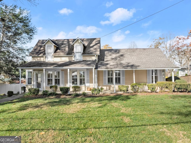 cape cod-style house with a front lawn