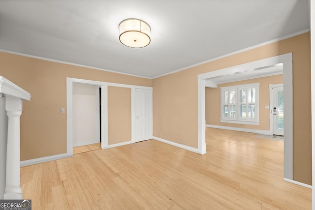 interior space featuring crown molding and light wood-type flooring