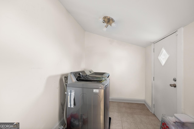 clothes washing area with washer and clothes dryer